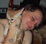 My husband Roman, and Shiva the fennec fox after a bath. Wet fox! My husband Roman, and Shiva the fennec fox after a bath. Wet fox!